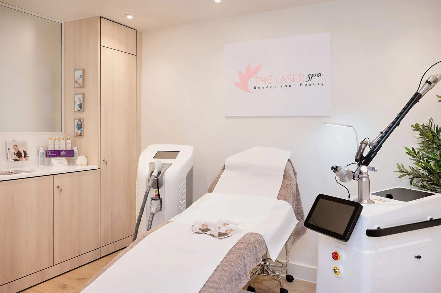 The Laser Spa treatment room with laser equipment and the original spa branding